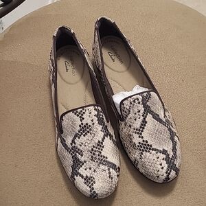 Clark's snake skin slip on's, in black and tan, super comfortable, new